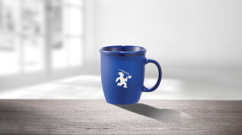 blue coffee mug with a printed graphic